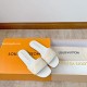 L Revival Flat Mules in white - Angled Presentation View Angled layout of L Revival Flat Mules in white resting on a signature orange presentation box