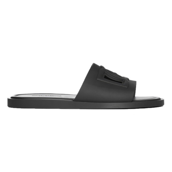 Side profile of Dolce & Gabbana black rubber slide showing molded footbed and embossed strap