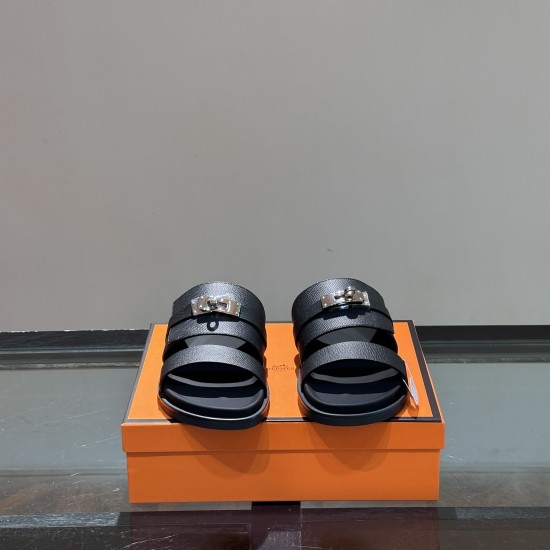 Hermes Jackson Leather Sandals In Black - Front Angle in black and silver Frontal view of the Hermes Jackson Leather Sandals In Black highlighting metallic closure details in black and silver