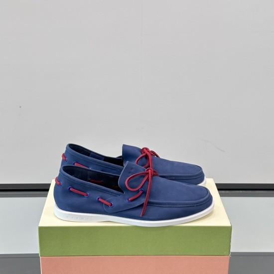 Side profile view of Marni Men's Blue Nubuck Boat Shoes displayed on a shoe box in blue and red