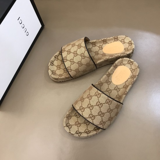 Angled top view of the beige and brown slide sandals highlighting the patterned footbed and contrast edging
