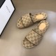 Angled top view of the beige and brown slide sandals highlighting the patterned footbed and contrast edging