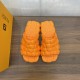 Fendi Cloud Slides in Orange - Top View with Box Top-down view of Fendi Cloud Slides in orange next to a matching branded box
