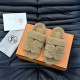 Hermes Chypre Brown Shearling Sandals Top View Flat top-down view of Hermes Chypre brown shearling sandals displayed on packaging box
