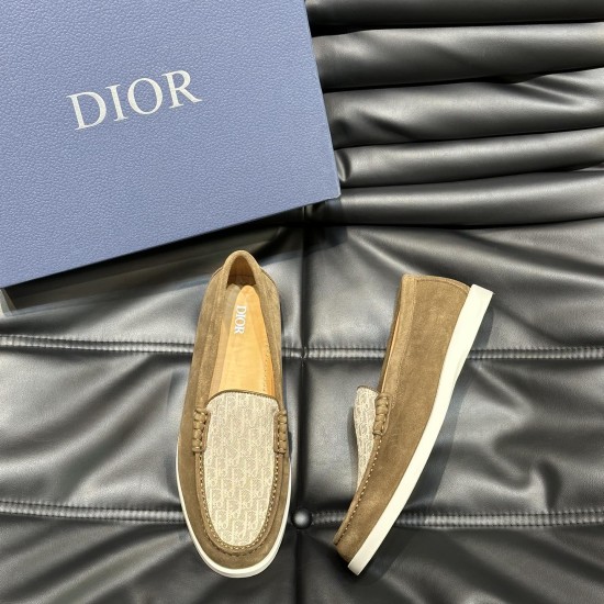 Top-down view of Dior Men's Granville brown suede loafer resting beside the branded shoe box in brown and beige