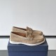 Pair of Dior Men's Granville Beige Suede Loafers resting on a blue shoebox in lateral view in beige and white