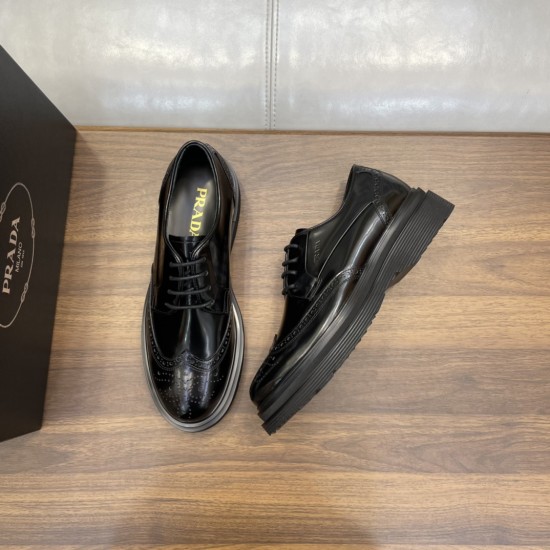 Angled view of black Prada Men's Brushed Leather Derby Brogue Shoes Angled top-down view of black Prada Men's Brushed Leather Derby Brogue Shoes beside a shoebox