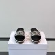 Dior Platform Slides Front View in white and brown Front facing view of Dior Platform Slides in white and brown displaying the wide embroidered straps