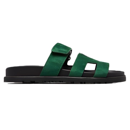 Hermes Chypre Suede Sandals In Dark Green - Outer Profile View Hermes Chypre suede sandals in dark green viewed from the outer side profile