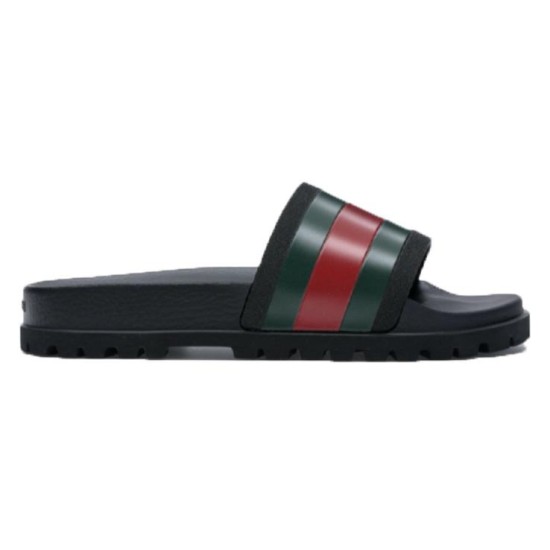 Gucci Slide Sandals Lateral Profile in Black in black and red Side profile view of black Gucci rubber slide sandals showcasing the red and green striped webbing strap