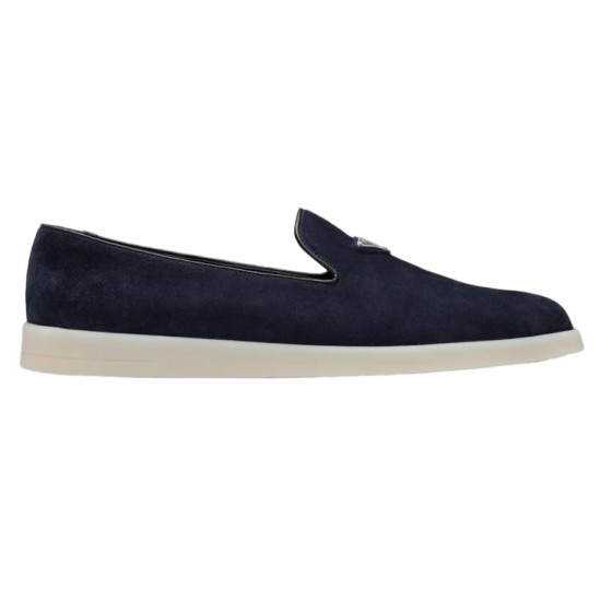 Side profile view of Prada Men's blue suede calf leather slip-on loafers featuring a white sole