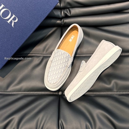 Angled view of Dior Men's Granville Grey Suede Patterned Loafers showing the patterned vamp and textured outsole tread pattern in grey and white