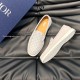 Angled view of Dior Men's Granville Grey Suede Patterned Loafers showing the patterned vamp and textured outsole tread pattern in grey and white
