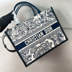 MEDIUM BOOK TOTE WHITE AND NAVY BLUE TOILE DE JOUY SAUVAGE EMBROIDERY WITH NAVY BLUE CALFSKIN UK MEDIUM BOOK TOTE WHITE AND NAVY BLUE TOILE DE JOUY SAUVAGE EMBROIDERY WITH NAVY BLUE CALFSKIN UK