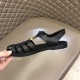 Gucci Black Sandals Inner View in black and gold Handheld view focusing on the inner side of the black rubber footwear in black and gold