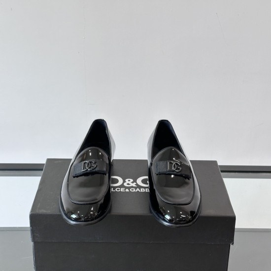Dolce & Gabbana Men's Black Patent Loafers Front Detail Dolce & Gabbana Men's Black Polished Patent Calfskin Loafers front view showing DG hardware