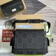Gucci Men's Men Jumbo Gg Baby Changing Bag In Black Uk set layout Men's Overhead layout showing the black baby bag alongside its matching changing pad and packaging