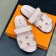Hermes Chypre Sandals In Light Pink Overhead View Top-down overhead view of Hermes Chypre Sandals In Light Pink resting on an orange box, highlighting the H-cutout straps