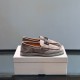 Dolce & Gabbana Men's Brown Suede Hardware Plaque Loafers pair displayed on box angled view