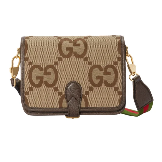 Men's Front View of Brown Jumbo GG Canvas Shoulder Bag Men's Front view of the brown jumbo GG canvas shoulder bag with a leather flap closure and gold-tone hardware