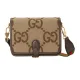 Men's Front View of Brown Jumbo GG Canvas Shoulder Bag Men's Front view of the brown jumbo GG canvas shoulder bag with a leather flap closure and gold-tone hardware