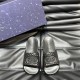 Gucci Black Rubber Slide Sandals Front Pair Front facing pair of black rubber slide sandals displayed alongside a branded box