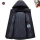 Interior view of open Canada Goose Men's coat showing black lining and inner pocket in black and white
