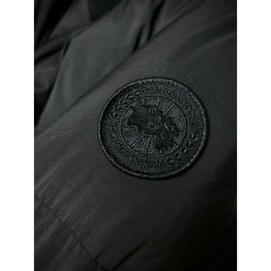Canada Goose Women's black puffer coat sleeve logo patch close-up