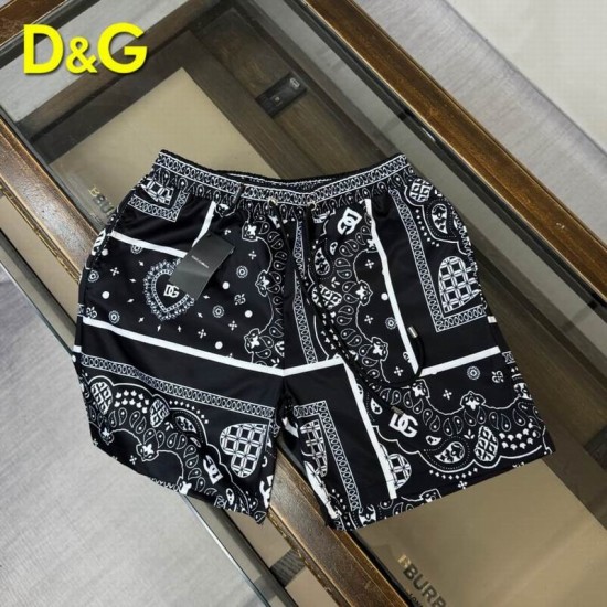 Dolce & Gabbana Men's Black Bandana Print Swim Shorts laid flat showing drawstring waist and pattern