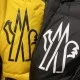 Detailed view of Moncler Men's chest logo prints on yellow and black fabrics