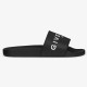 Givenchy Black Rubber Pool Slides Profile in black and white Profile view of Givenchy black rubber pool slides showing the bold white logo strap and side midsole branding