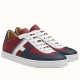 Pair of Hermes Boomerang multicolour leather low top trainers angled side view