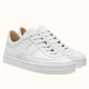 Hermes Boomerang White Grain Leather Trainers Pair View Pair of Hermes Boomerang white grain leather trainers displayed at an angle against a plain background.