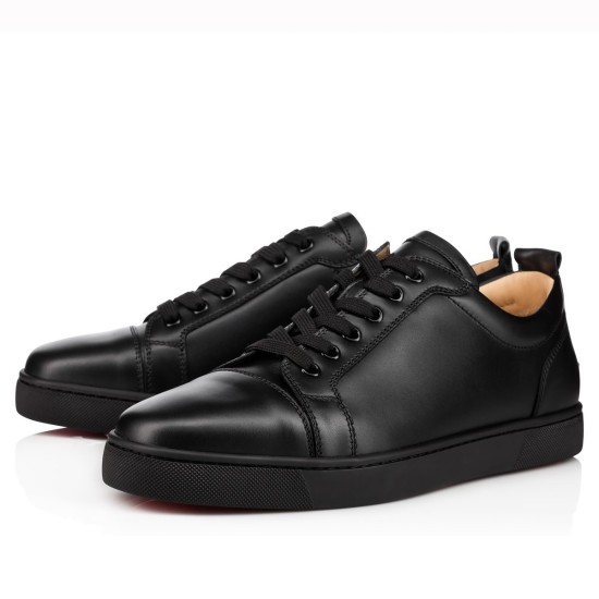 Christian Louboutin Louis Junior Flat Black Leather Trainers Pair Pair of Christian Louboutin Louis Junior Flat black leather low top trainers shown from a three-quarter angle