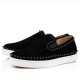 Side profile view of Christian Louboutin Pik Boat Flat slip-on trainers in black suede with black spikes and white soles