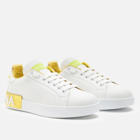 Dolce & Gabbana Portofino Trainers Front View in white and yellow Front perspective view of Dolce & Gabbana white leather Portofino trainers with yellow accents
