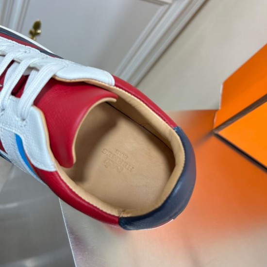 Close-up of the internal tan leather insole with embossed Hermes Paris branding in multicolour