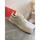 Christian Louboutin Louis Junior Flat White Leather Trainer Side Profile Side profile of Christian Louboutin Louis Junior Flat white leather trainer showing side eyelets