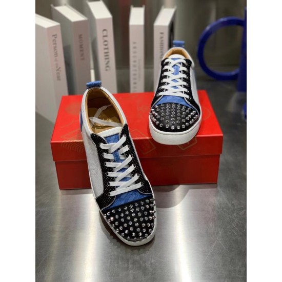 Christian Louboutin Louis Junior Spikes Orlato Overhead View in white and blue Top-down view of white and blue Christian Louboutin Louis Junior Spikes Orlato low top trainers on red shoebox