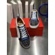 Christian Louboutin Louis Junior Spikes Orlato Overhead View in white and blue Top-down view of white and blue Christian Louboutin Louis Junior Spikes Orlato low top trainers on red shoebox