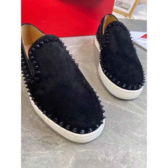 Front close-up of toe caps on black Christian Louboutin Pik Boat Flat suede trainers with black spikes in black and white