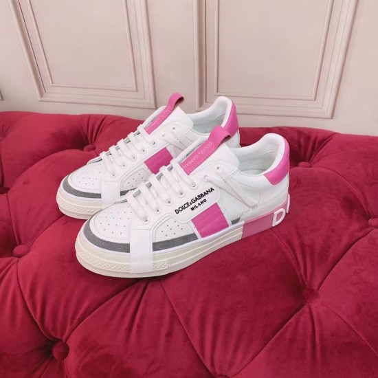 Dolce & Gabbana Custom 2.Zero White And Pink Trainers Pair Pair of white and pink Dolce & Gabbana Custom 2.Zero trainers on red tufted surface