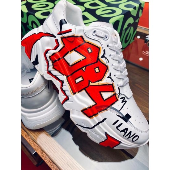 Dolce & Gabbana White Trainers Graphic Close-Up View Close-up view of 1984 print and Milano lettering on Dolce & Gabbana white trainers