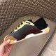 Dolce & Gabbana Grey Mesh Trainer Medial View in grey and yellow Inner medial side view of the Dolce & Gabbana grey mesh trainer held in hand in grey and yellow