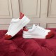 Side view of two white trainers resting against each other showing thick white soles in white and red