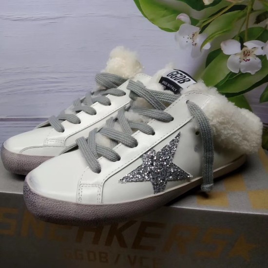 Golden Goose Super-Star Sabot Low Angle View in white Golden Goose Super-Star Sabot white leather trainers low angle view on product box