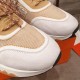 Hermes Addict Knit Trainers Toe Box Detail in beige and white Close-up of the white suede toe cap and patterned knit toe box on Hermes Addict Knit Trainers in beige and white
