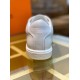 Rear view highlighting embossed brand detail on heel counter and sole in white