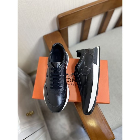 Hermes Drive Leather Low Top Trainers Black Pair View in black and white Pair of Hermes Drive Leather Low Top Trainers Black displayed together showing front and lateral details in black and white