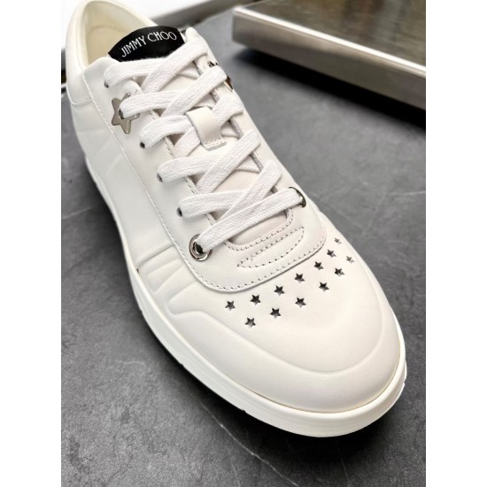 Jimmy Choo Hawaii White Trainer Toe Close-Up Close-up of star perforations and lace detail on Jimmy Choo Hawaii white trainer toe